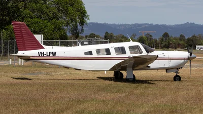 VH-LPW aircraft parked beside the airfield